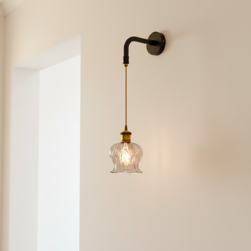 Fluted glass wall light mounted on a plain plaster wall