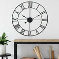 Roman numeral wall clock in blackened metal, 40cm, open frame
